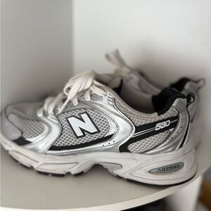 New Balance Women Metallic Silver Sneakers